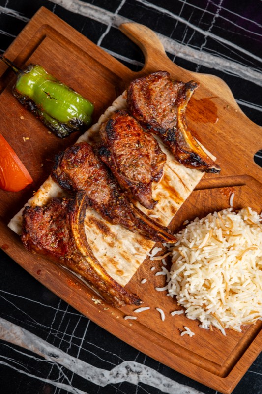 Lamb chops on a wooden board