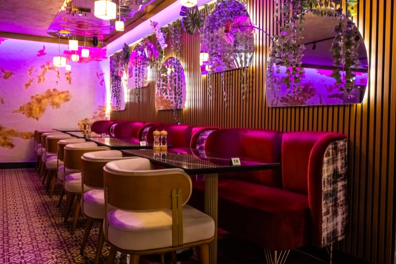 The lounge banquette under coloured light